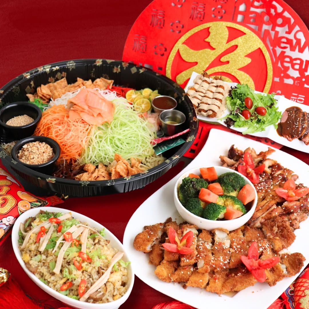 A festive Lunar New Year spread at The Tree Cafe featuring Smoked Salmon Yusheng and sharing platters.
