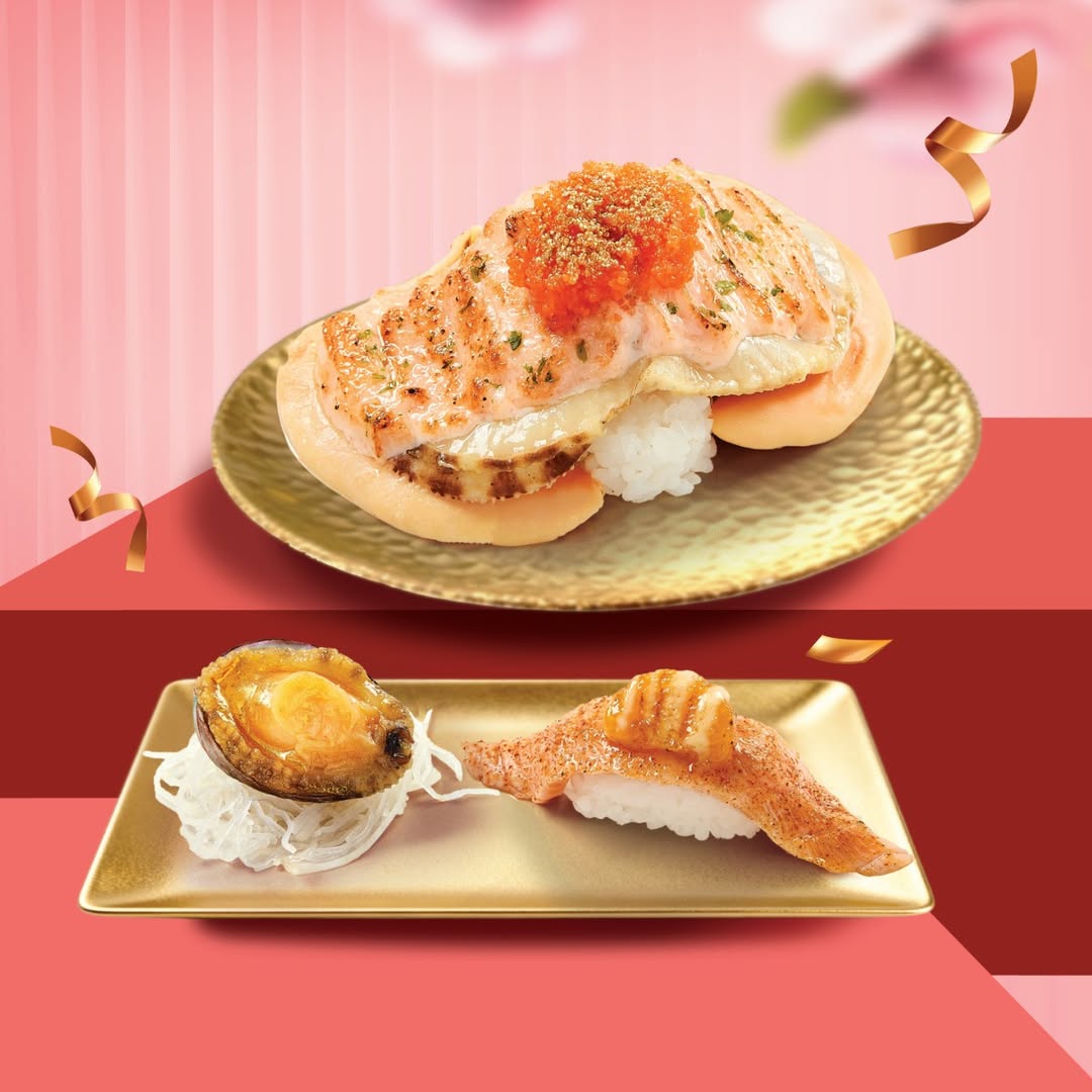 A delicious assortment of festive sushi featuring salmon, abalone, and scallops