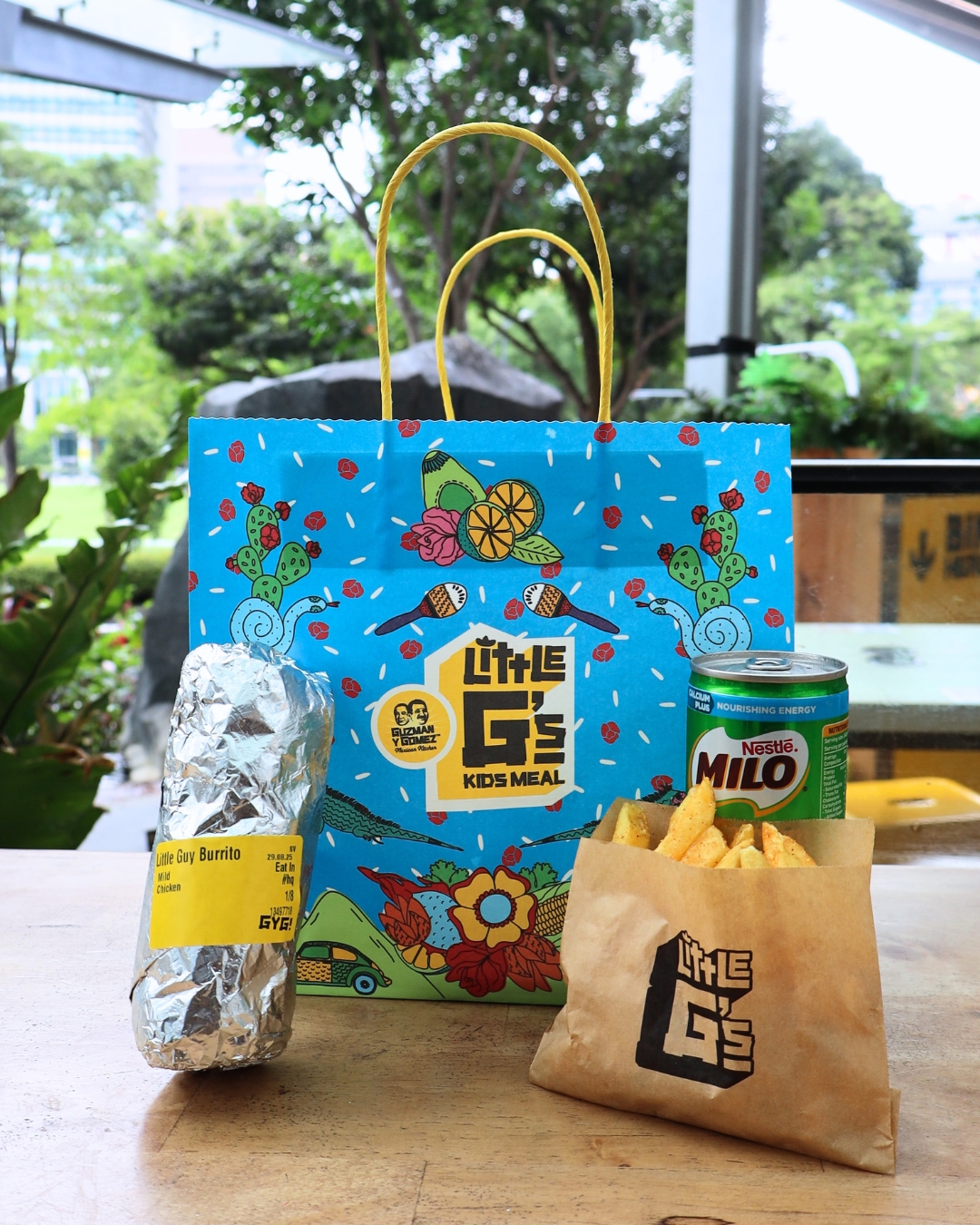 A vibrant image showcasing a family-friendly dining setup at Guzman y Gomez Funan.