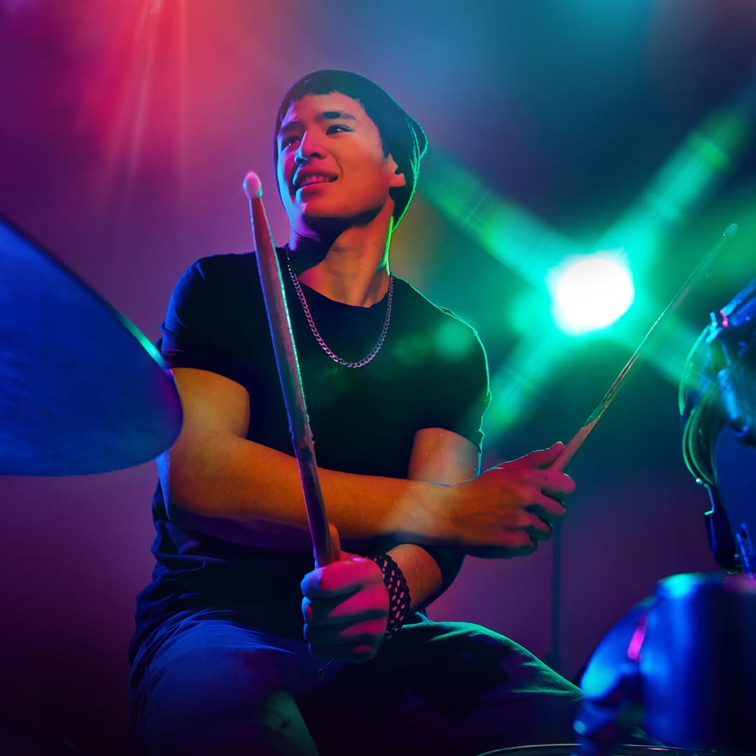 A dynamic image of a drummer performing.